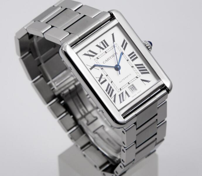 The blue hands are contrasted to the silver dial.